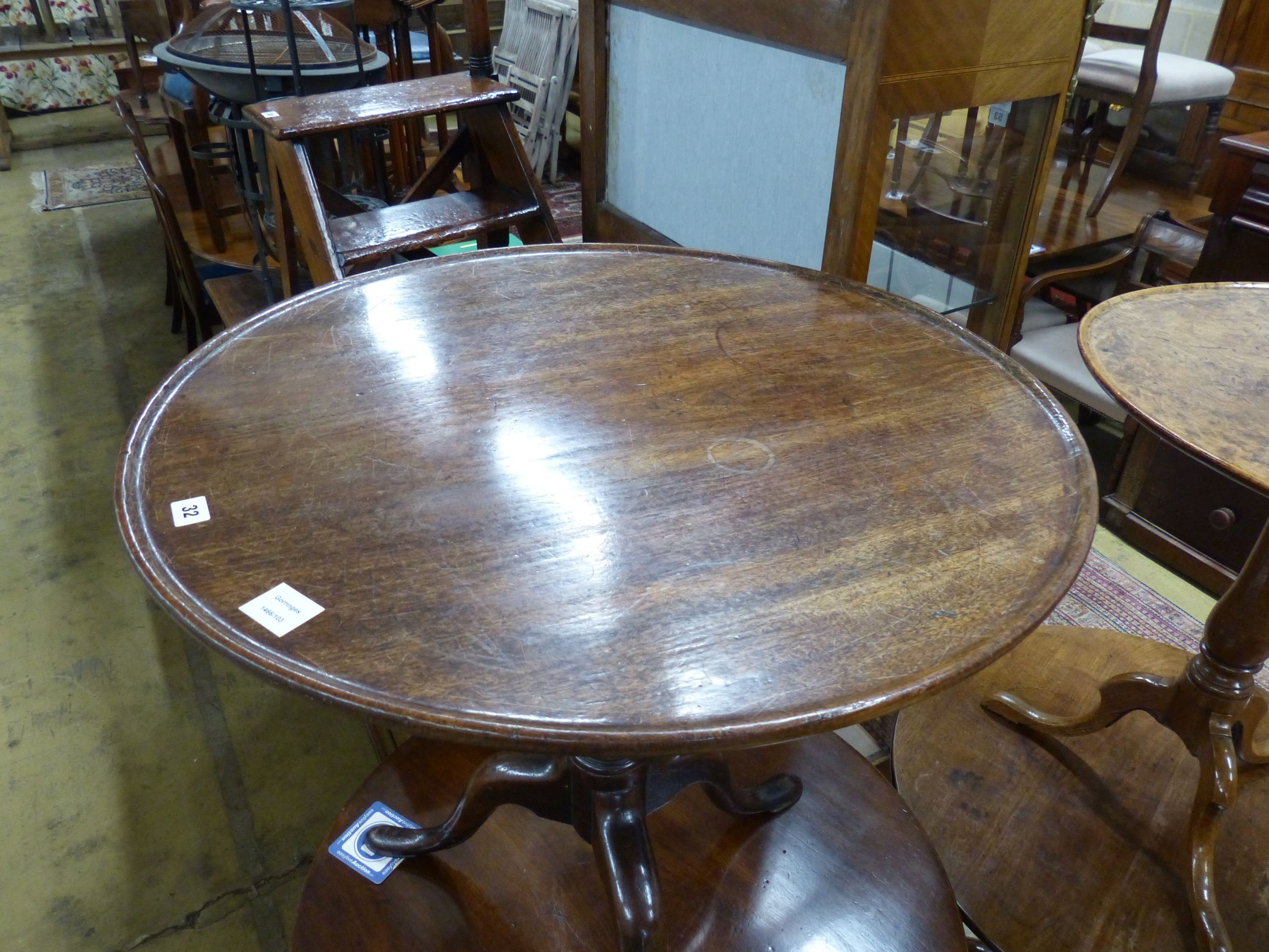 A George III mahogany birdcage tea table with circular tilt top, Diam.74cm H.74cm